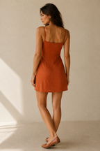 Rust linen a-line mini dress, back view, simple back with spaghetti straps