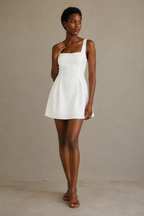 White linen a-line mini dress, full front view, smooth bodice, flared mini skirt