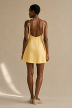 Butter yellow linen a-line mini dress, back view, open back, self-tie straps