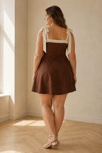 Brown linen a-line mini dress, back view, smooth back and defined waist