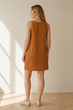 Rust linen shift mini dress, back view, smooth back, unadorned design