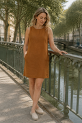 Rust linen shift mini dress, front view, round neckline, side pockets, sleeveless