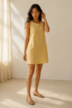 Butter yellow linen shift mini dress, three-quarter view, relaxed fit, linen drape