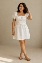 Ivory linen a-line mini dress, full front view, shirred bodice and A-line skirt