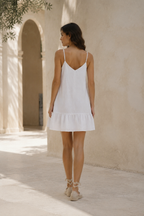White linen shift mini dress, back view, flowing back, simple construction