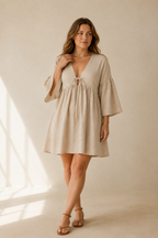 Beige linen a-line mini dress, full front view, gathered waist and flared skirt