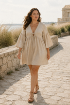 Beige linen a-line mini dress, lifestyle, quiet morning light at home