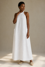 White linen shift mini dress, full front view, halter neckline and shift silhouette