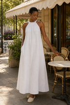 White linen shift mini dress, front view, halter neck and gathered detail