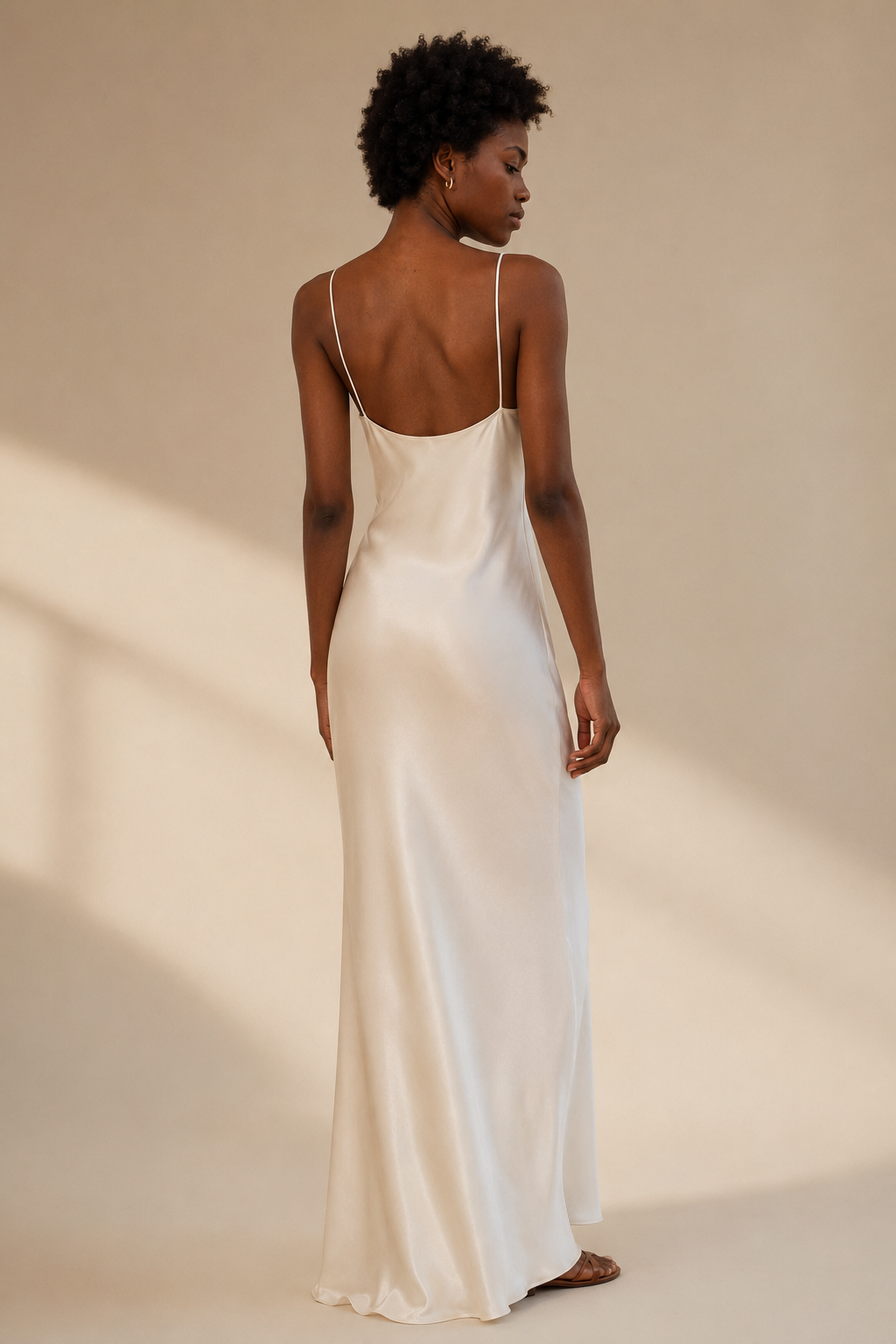 White silk slip maxi dress, back view, fine straps and long fall