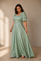 Mint green silk a-line maxi dress, three-quarter view, gentle fabric drape and full skirt