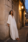 White linen shift maxi dress, front view, deep V-neck and relaxed silhouette