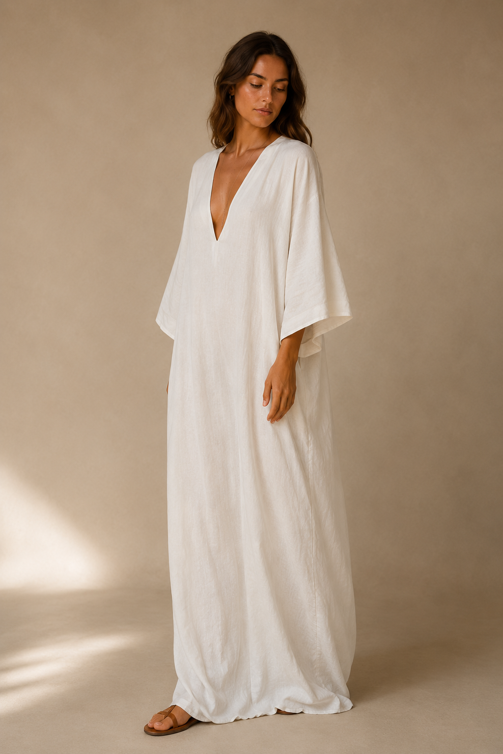 White linen shift maxi dress, three-quarter view, loose sleeves and relaxed fit