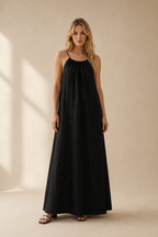 Black linen slip maxi dress, full front view, loose maxi silhouette