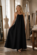 Black linen slip maxi dress, lifestyle, stroll along a quiet path