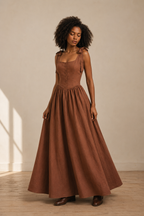 Brown linen a-line maxi dress, three-quarter view, flowing skirt and tie straps