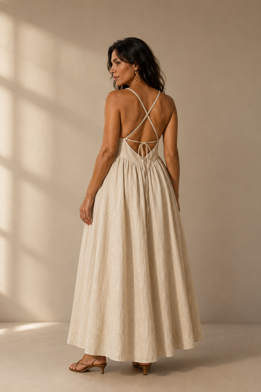 Ivory linen a-line maxi dress, back view, criss-cross back straps, tie closure