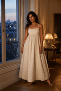 Ivory linen a-line maxi dress, front view, criss-cross back straps and gathered waist