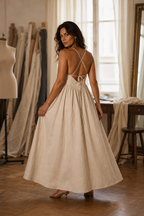 Ivory linen a-line maxi dress, lifestyle, sunlit wall, gentle shadows