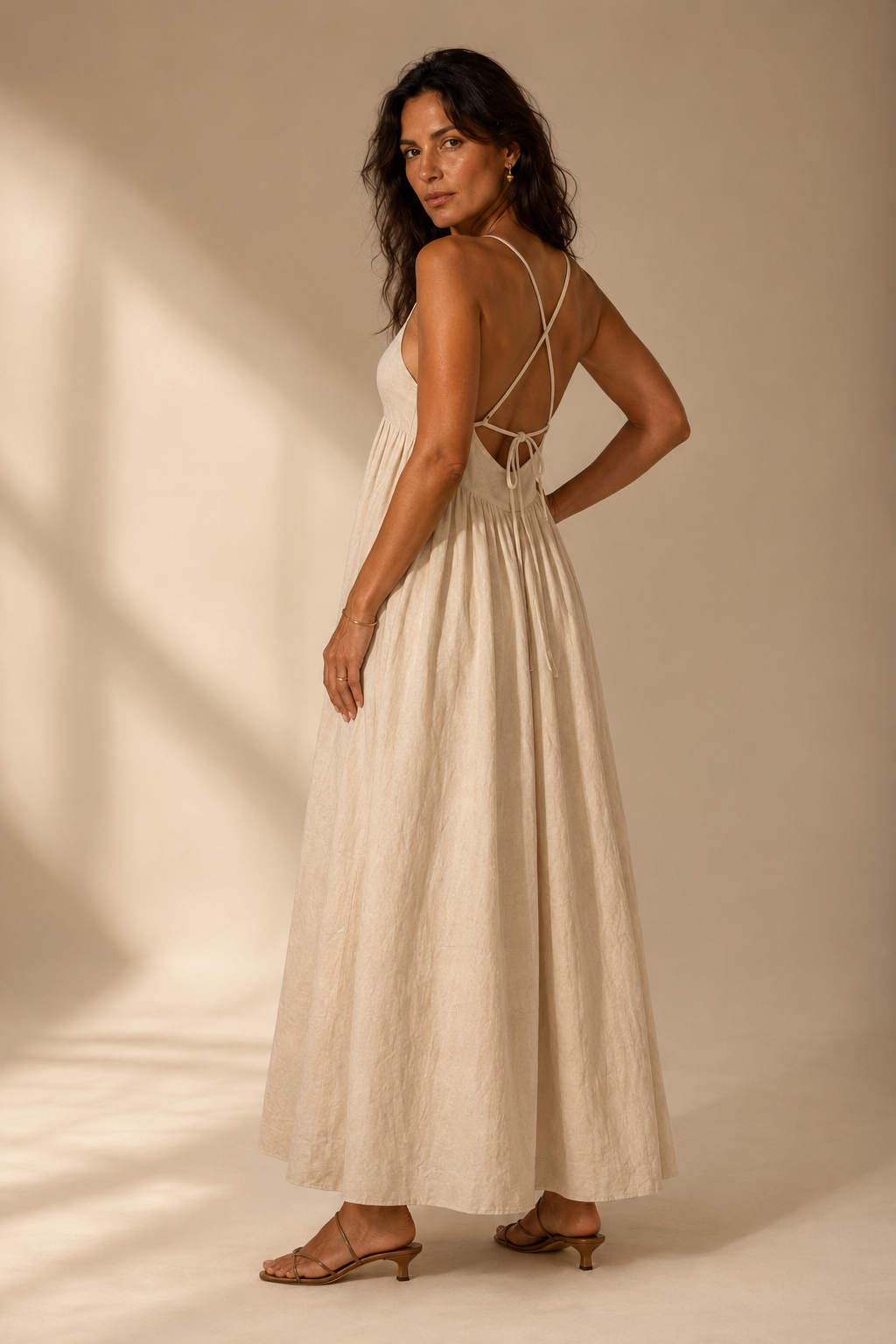 Ivory linen a-line maxi dress, three-quarter view, flowing A-line skirt, fitted bodice