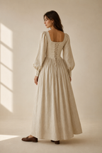 Beige linen a-line maxi dress, back view, structured top, flowing skirt