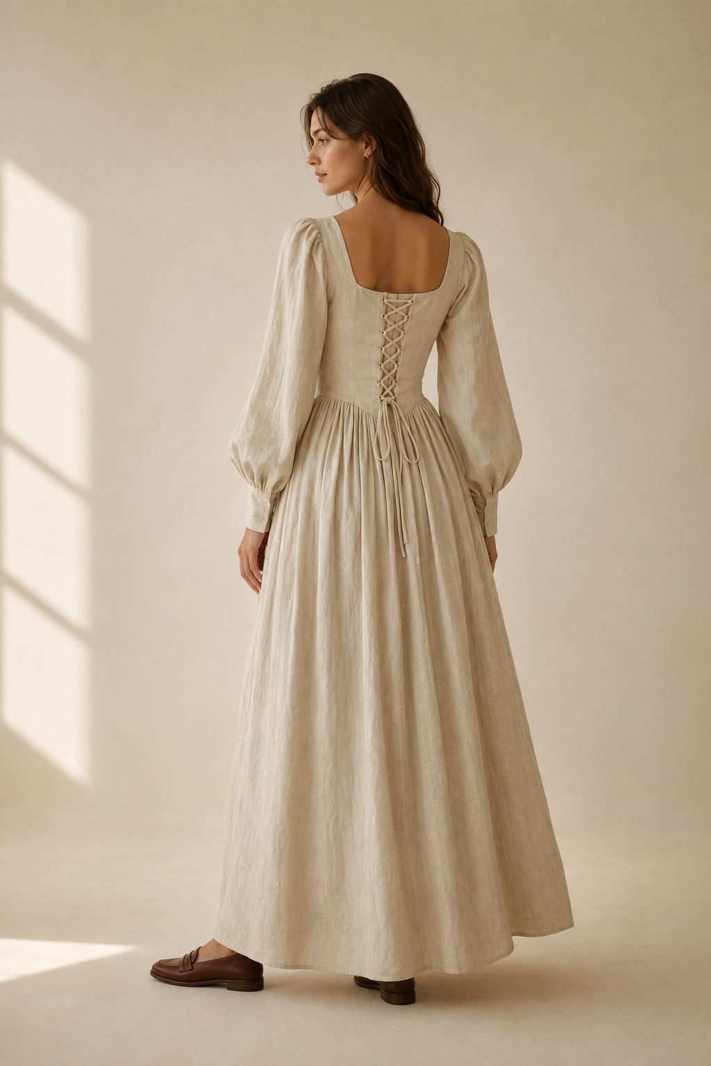 Beige linen a-line maxi dress, back view, structured top, flowing skirt
