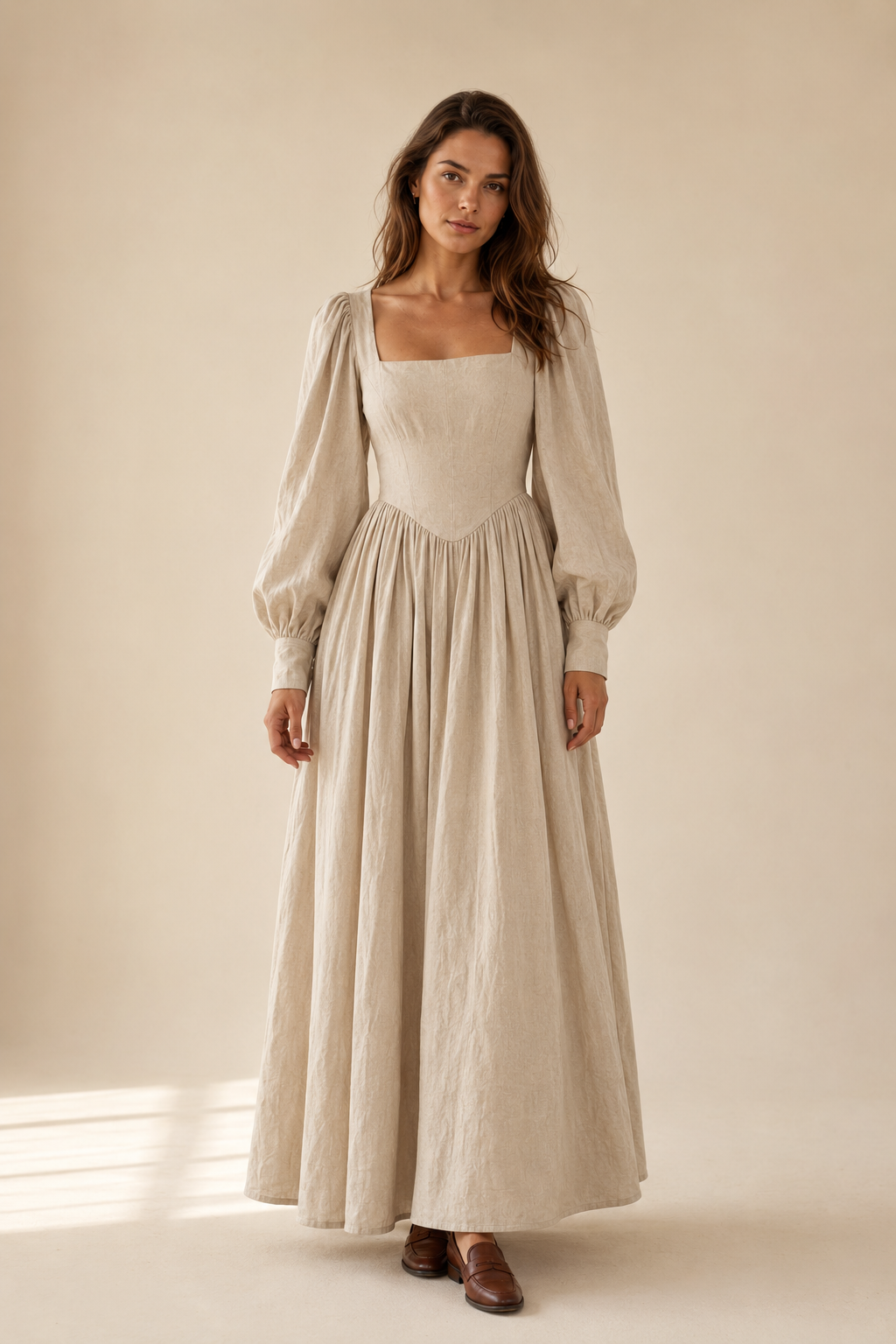 Beige linen a-line maxi dress, full front view, fitted bodice, pleated maxi skirt