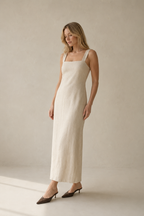 Ivory linen column maxi dress, three-quarter view, fluid drape, relaxed fit