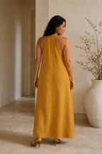 Mustard yellow linen shift maxi dress, back view, halter neck straps, fluid drape