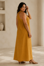 Mustard yellow linen shift maxi dress, three-quarter view, flowy skirt, soft linen drape