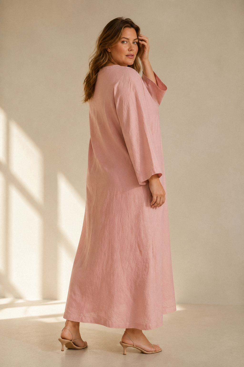 Dusty pink linen shift maxi dress, three-quarter view, soft drape and effortless silhouette