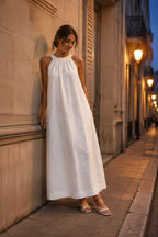 White linen shift maxi dress, front view, halter neckline and relaxed silhouette