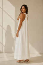 White linen shift maxi dress, three-quarter view, relaxed fit and natural fabric drape
