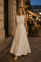 Ivory linen a-line maxi dress, lifestyle, sunlit courtyard, relaxed afternoon