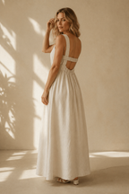 Ivory linen a-line maxi dress, three-quarter view, relaxed silhouette, natural drape, full skirt