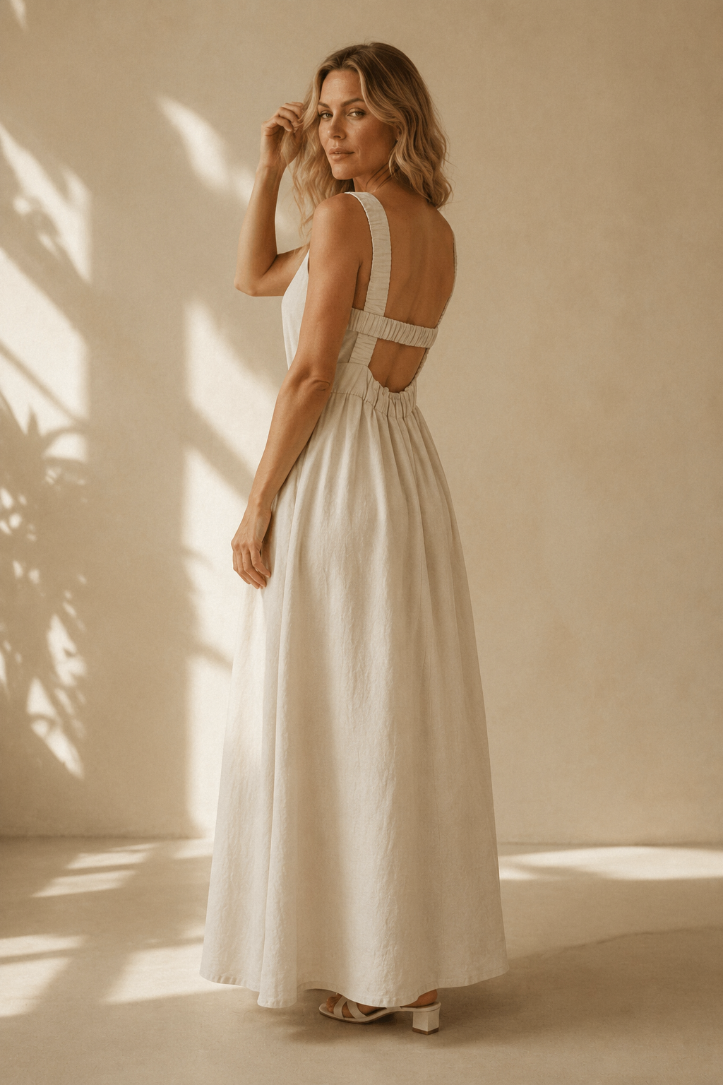 Ivory linen a-line maxi dress, three-quarter view, relaxed silhouette, natural drape, full skirt