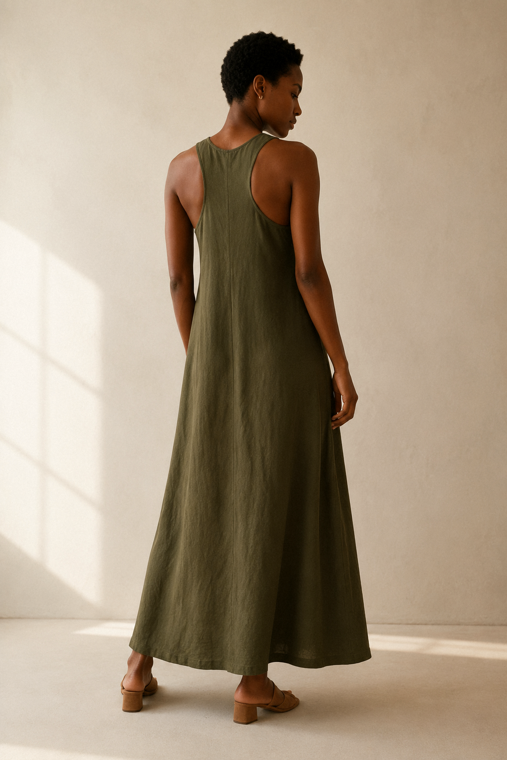 Olive green linen shift maxi dress, back view, relaxed back silhouette