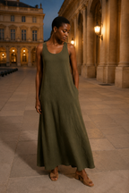 Olive green linen shift maxi dress, front view, straw hat and scoop neckline