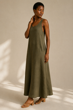 Olive green linen shift maxi dress, three-quarter view, flowy linen skirt and side pockets