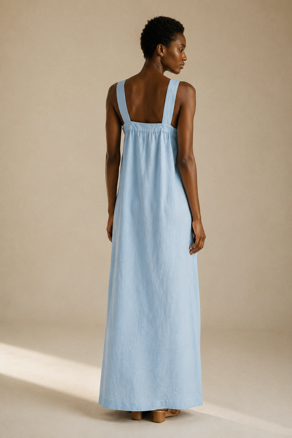 Light blue linen shift maxi dress, back view, open back with secure halter straps