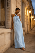 Light blue linen shift maxi dress, front view, twisted halter neckline and flowing maxi silhouette