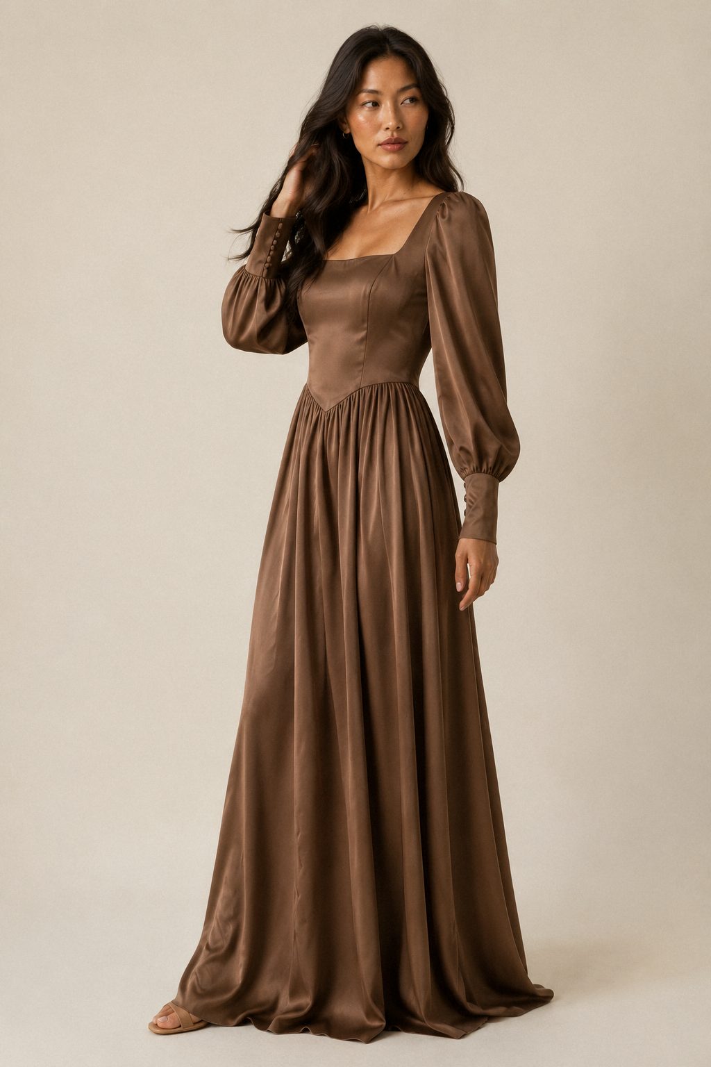 Mocha brown crepe a-line maxi dress, three-quarter view, full skirt drape and long sleeves