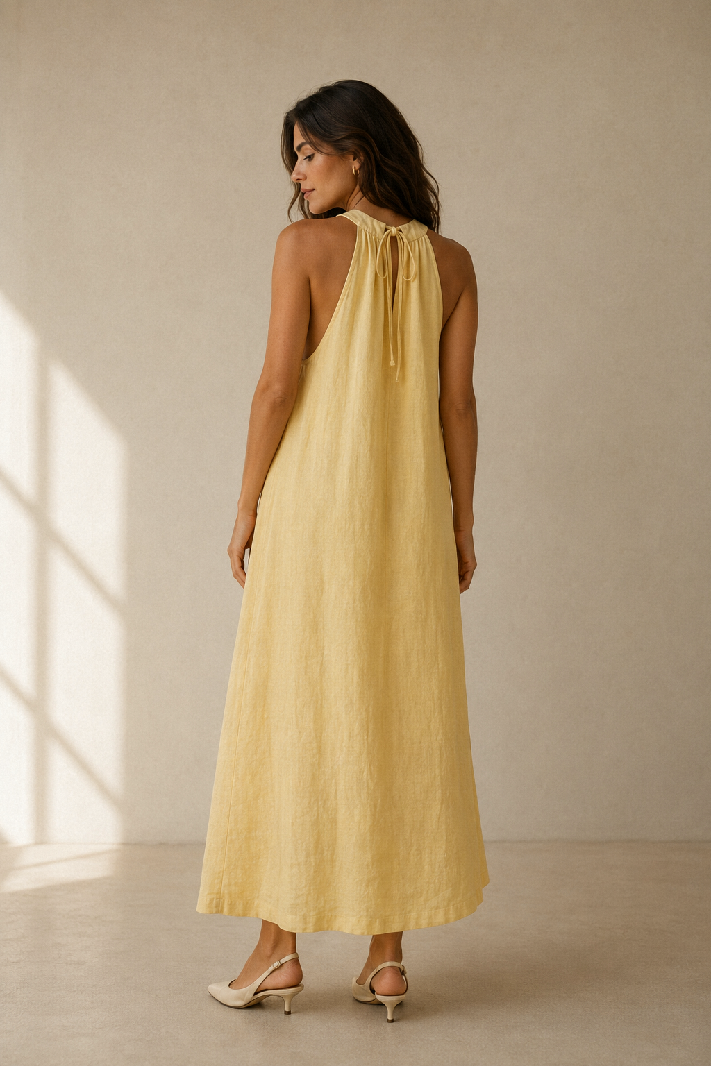 Butter yellow linen shift maxi dress, back view, smooth back and halter neck detail
