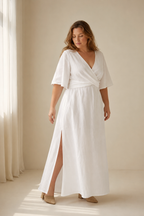 White linen wrap maxi dress, three-quarter view, wrap silhouette and side leg slit