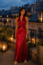 Red silk column maxi dress, lifestyle, golden hour reflections on warm stone