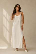 Ivory linen slip maxi dress, full front view, relaxed slip silhouette with side pockets
