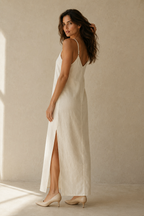 Ivory linen slip maxi dress, three-quarter view, flowing maxi length and natural fabric drape