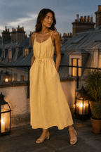 Butter yellow linen slip maxi dress, lifestyle, strolling in warm light