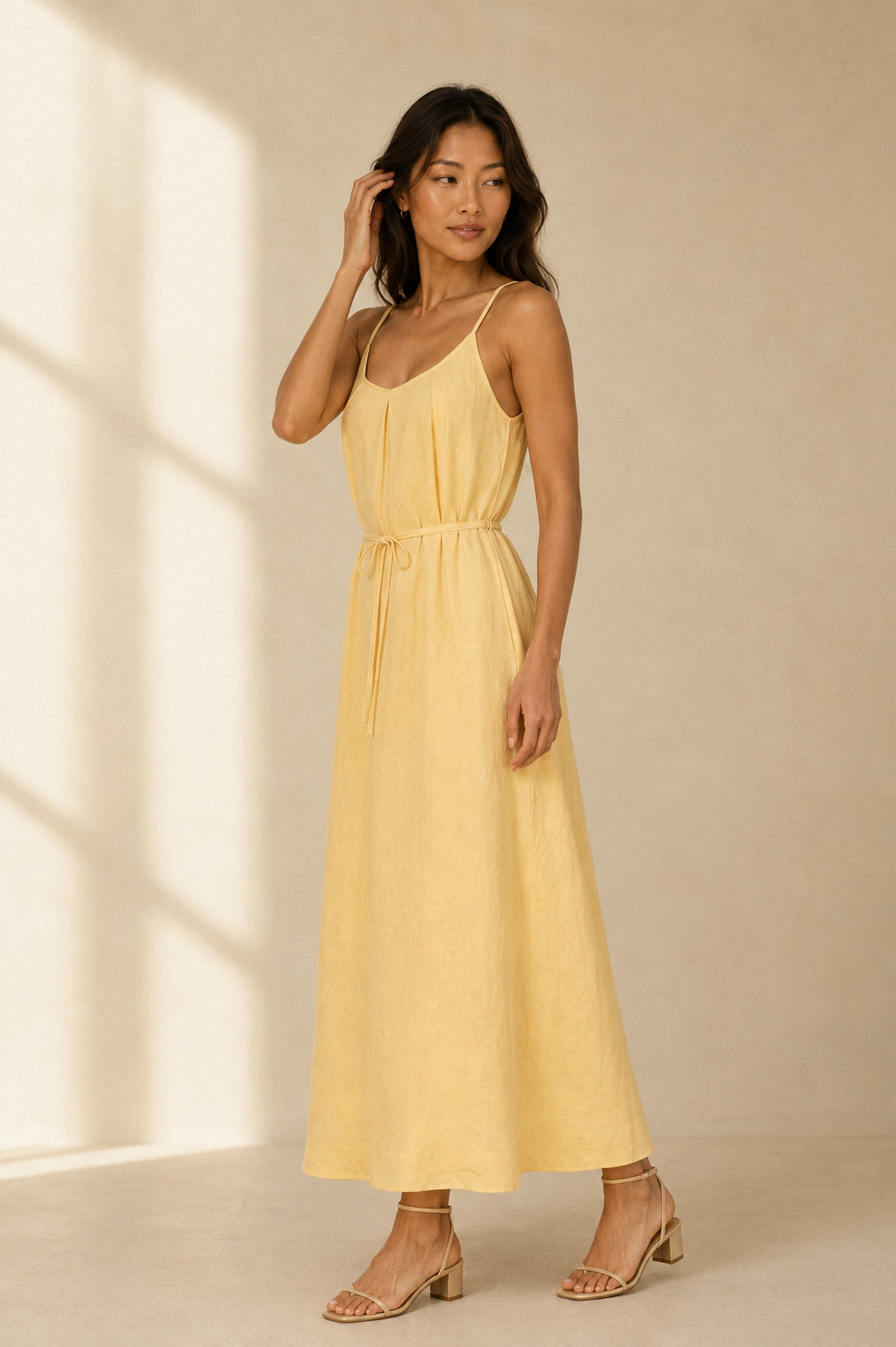 Butter yellow linen slip maxi dress, three-quarter view, relaxed fit and natural fabric drape