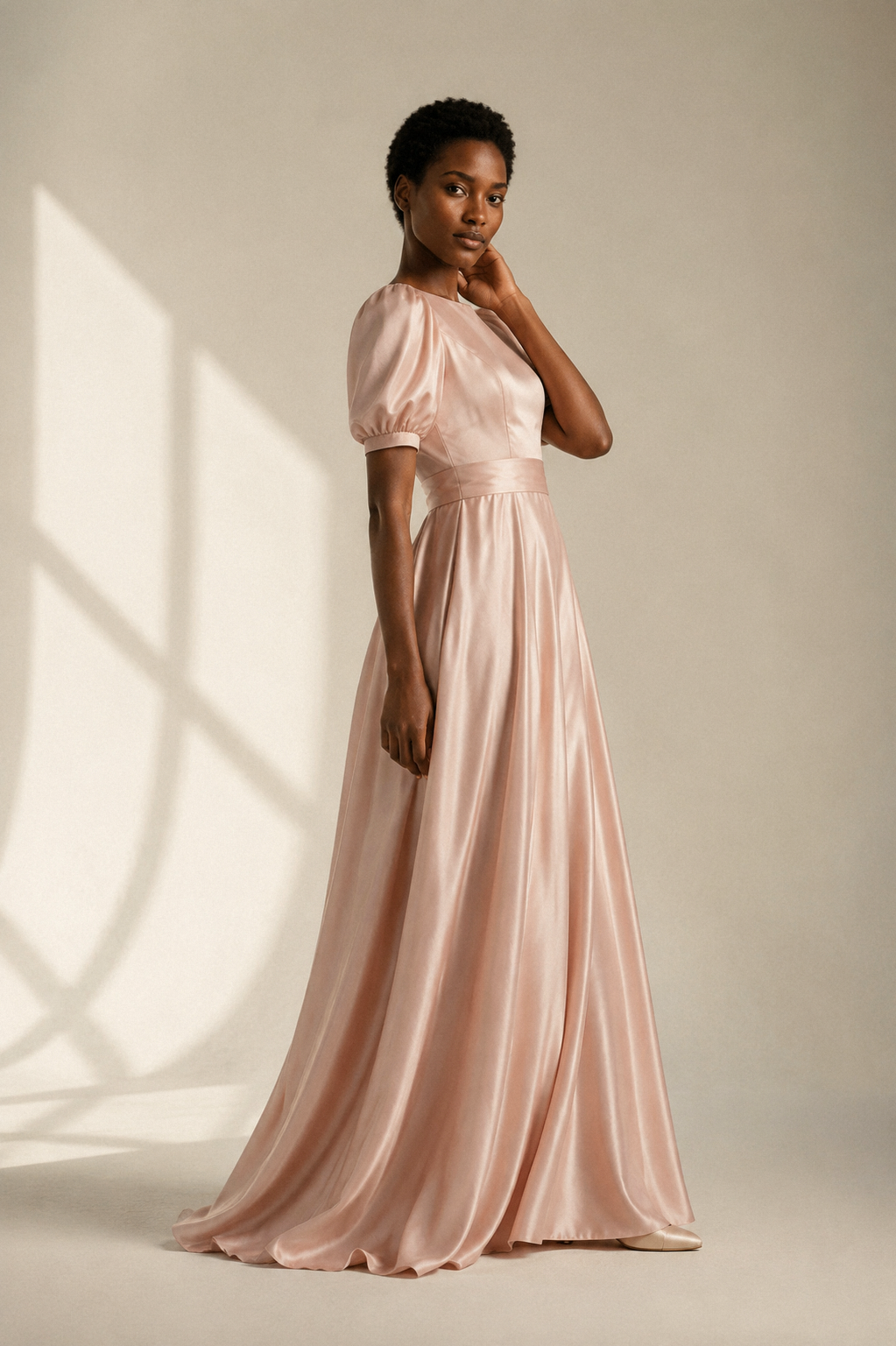 Blush pink silk a-line maxi dress, three-quarter view, gentle drape, full skirt movement